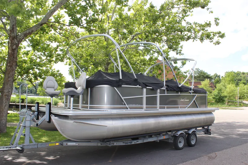 Slide: The Image of 2021 SunChaser Geneva Cruise 24 SB pontoon boat on a trailer in a park. - 39