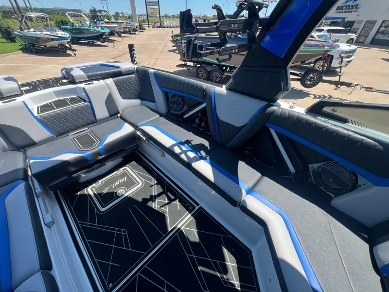 Slide: The Image of 2023 Tigé 25ZX boat interior with modern seating and sleek design. - 11