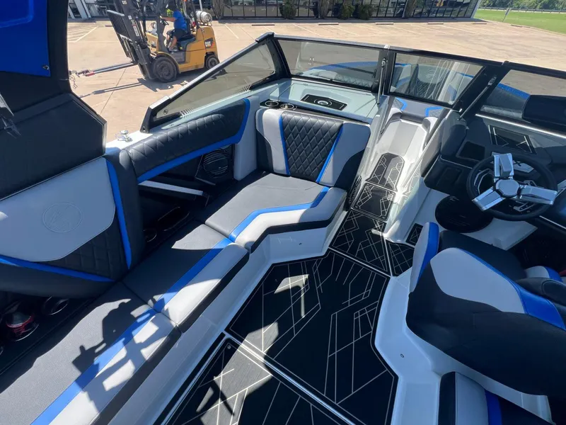 Slide: The Image of 2023 Tigé 25ZX boat interior with modern seating and sleek design. - 12