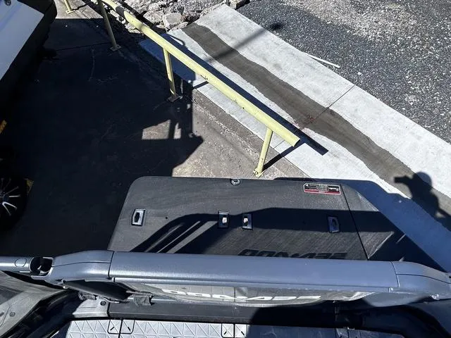 Slide: The Image of 2023 Sea-Doo Switch® 19-170 hp, rear view, docked on a sunny day. - 12