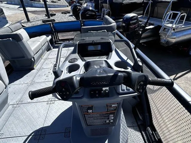 Slide: The Image of 2023 Sea-Doo Switch® 19-170 hp dashboard and steering, showcasing modern controls and seating. - 14