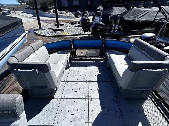 Slide: The Image of 2023 Sea-Doo Switch® 19-170 hp pontoon boat interior with gray seating and spacious deck. - 15