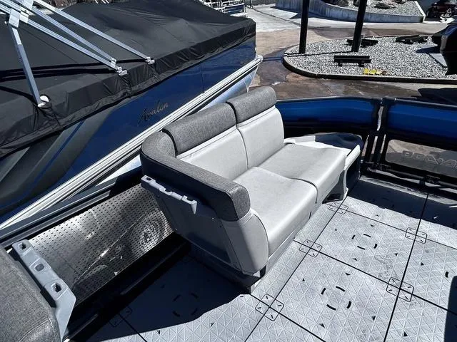 Slide: The Image of 2023 Sea-Doo Switch® 19-170 hp boat with gray seating and spacious deck. - 16