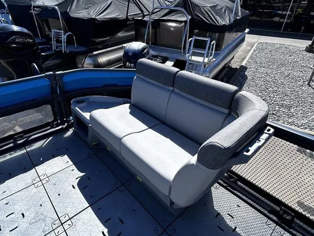 Slide: The Image of 2023 Sea-Doo Switch® 19-170 hp boat interior with gray seating and textured flooring. - 17