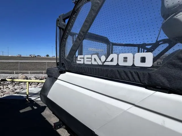 Slide: The Image of 2023 Sea-Doo Switch® Cruise 18-130 hp pontoon boat interior with seating and control console. - 3