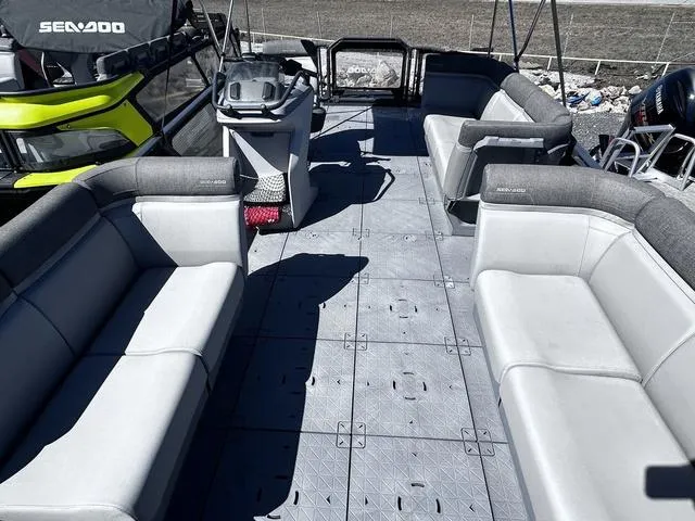 Slide: The Image of 2023 Sea-Doo Switch® 19-170 hp pontoon boat interior with spacious seating and modern design. - 8