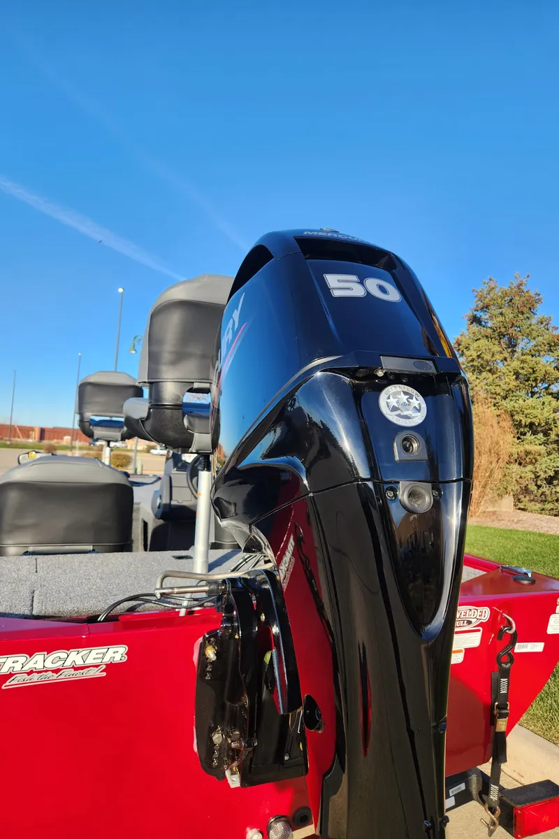 Slide: The Image of 2024 Tracker Pro 170 boat with a 50 HP engine, red exterior. - 3