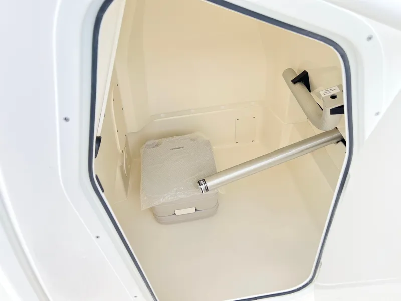 Slide: The Image of Interior storage compartment of 2024 Boston Whaler 220 Dauntless boat. - 11
