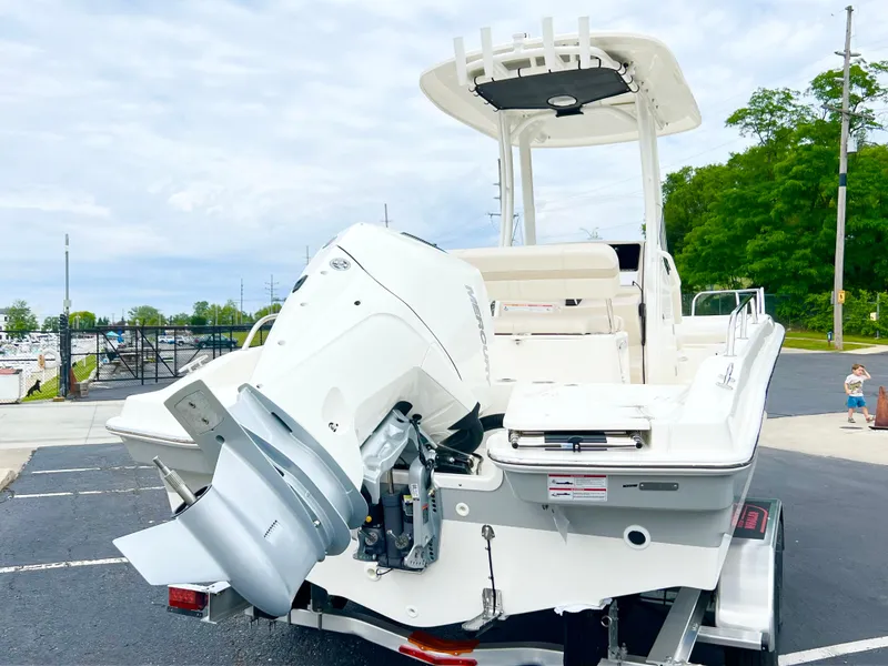Slide: The Image of 2024 Boston Whaler 220 Dauntless boat on trailer, rear view. - 2