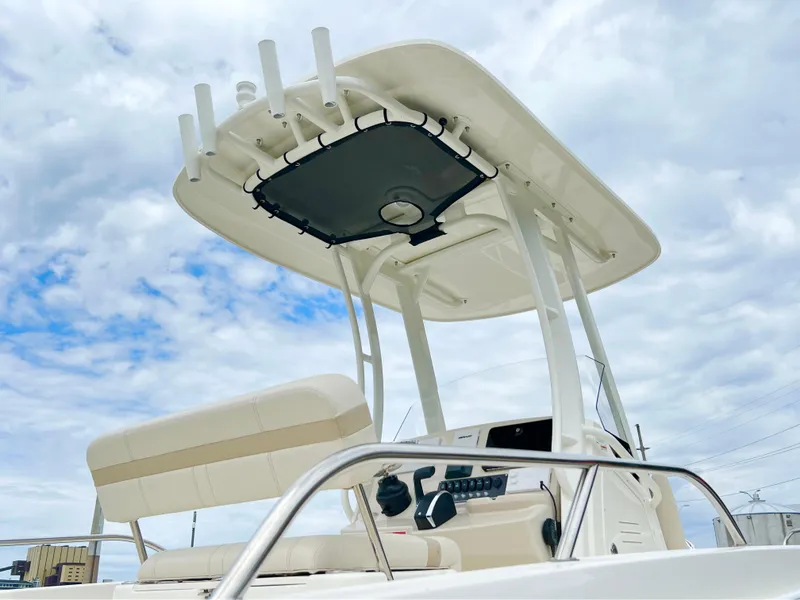 Slide: The Image of 2024 Boston Whaler 220 Dauntless center console boat with T-top and seating. - 3