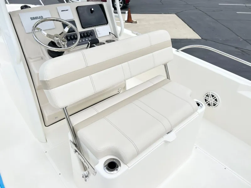 Slide: The Image of 2024 Boston Whaler 220 Dauntless boat interior with helm seat and console. - 7