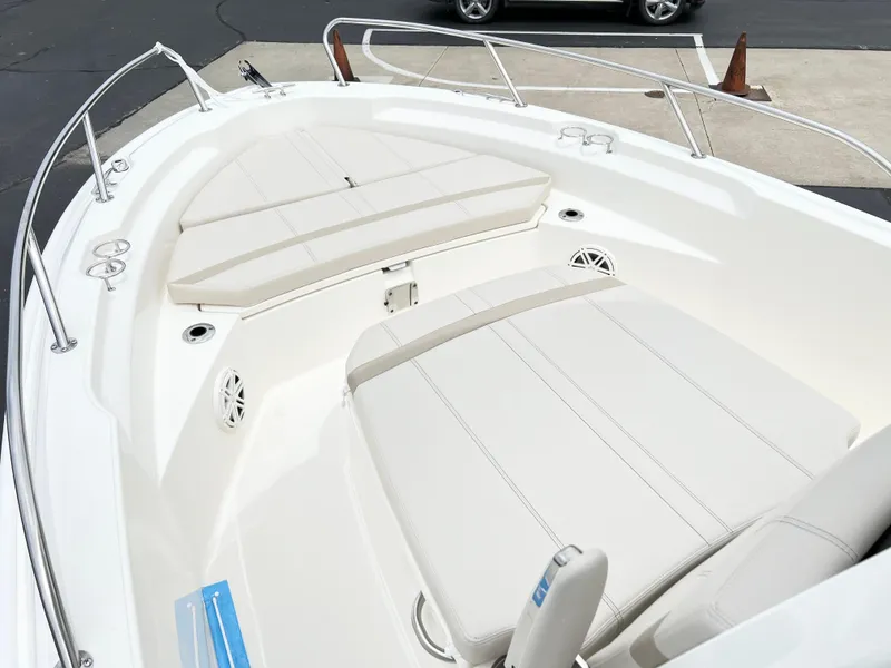 Slide: The Image of 2024 Boston Whaler 220 Dauntless boat interior with cushioned seating. - 8