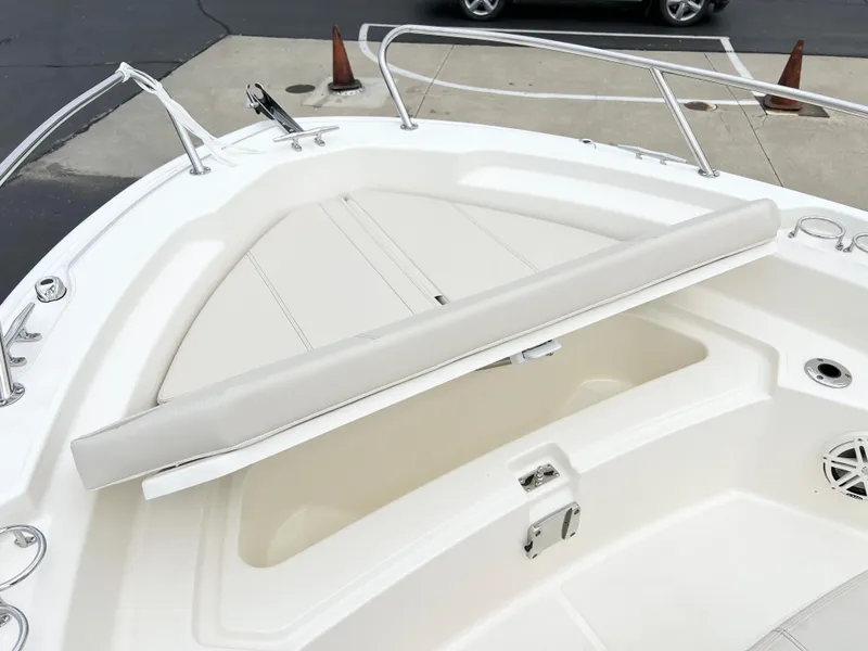 Slide: The Image of 2024 Boston Whaler 220 Dauntless bow seating and storage area. - 9