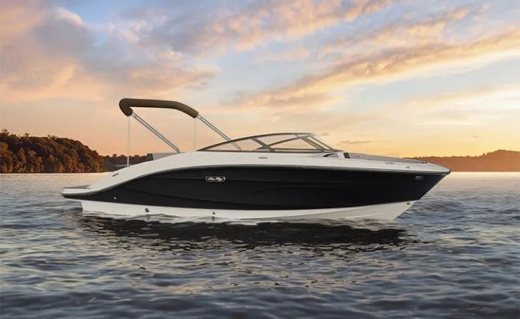 Slide: The Image of 2024 Sea Ray SPX 210 boat on calm water at sunset. - 1
