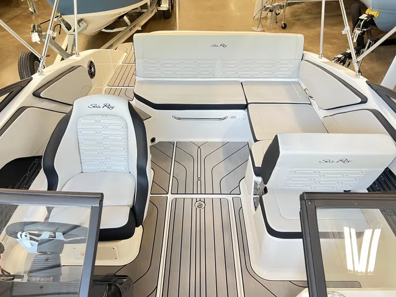 Slide: The Image of 2024 Sea Ray SPX 210 boat interior with white and black seating. - 3