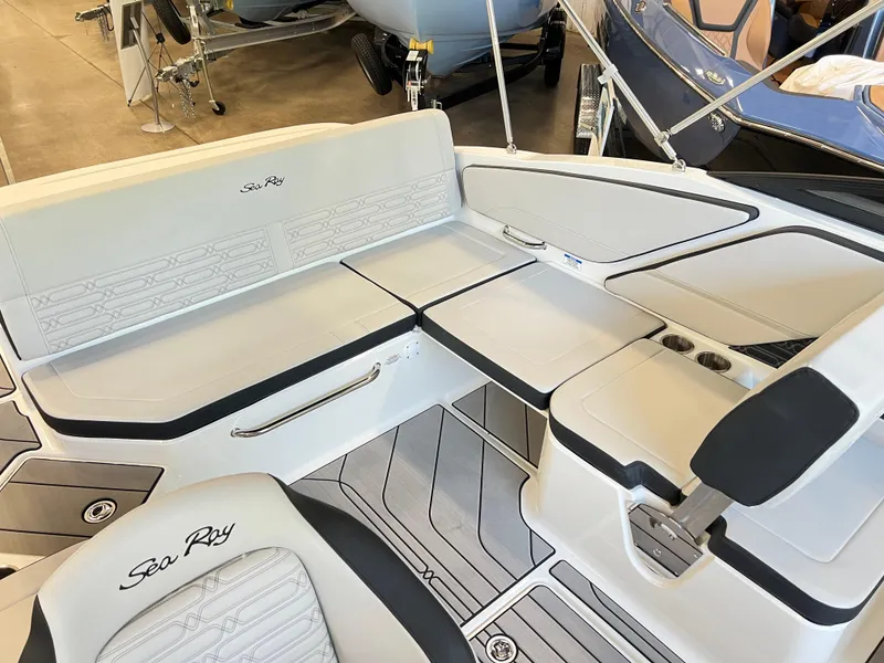 Slide: The Image of 2024 Sea Ray SPX 210 boat interior with white and black seating. - 5