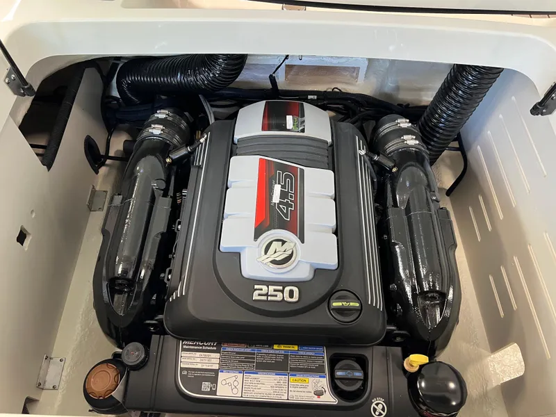 Slide: The Image of 2024 Sea Ray SPX 210 boat engine compartment with a powerful 250 HP engine. - 6