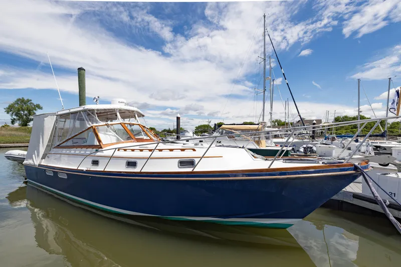 Slide: The Image of 1990 Little Harbor 34 Express Direct Drive boat docked in a marina. - 0