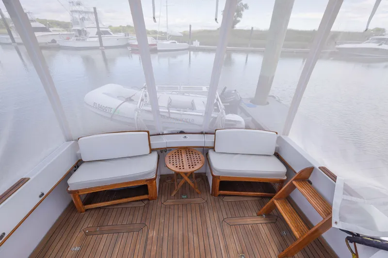 Slide: The Image of Enclosed seating area on 1990 Little Harbor 34 Express Direct Drive boat. - 17