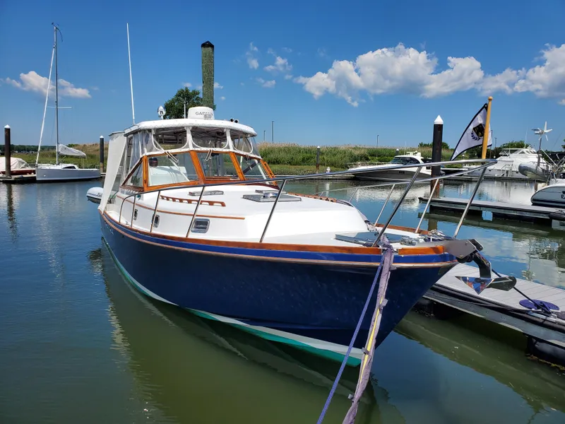 Slide: The Image of 1990 Little Harbor 34 Express Direct Drive boat docked in a marina. - 21