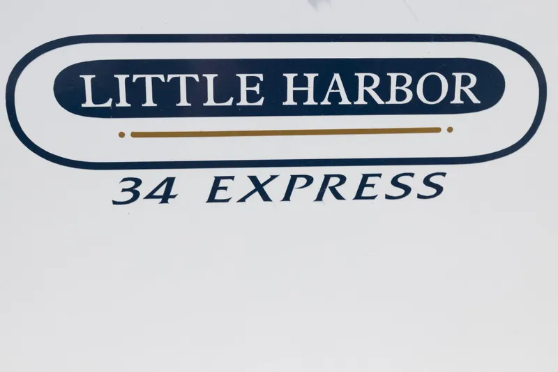 Slide: The Image of Little Harbor 34 Express logo on a 1990 model boat. - 23