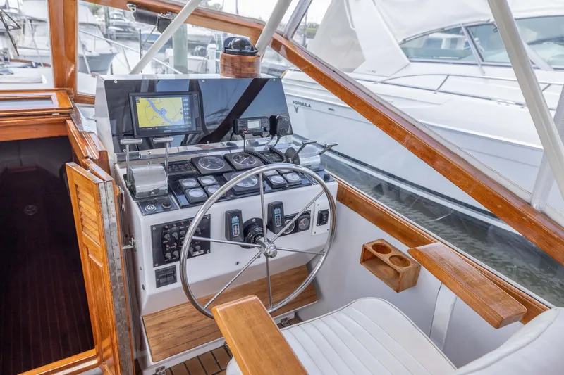Slide: The Image of 1990 Little Harbor 34 Express Direct Drive boat helm with navigation equipment. - 4
