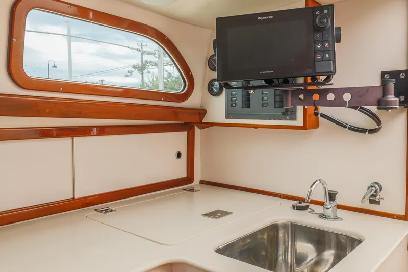 Slide: The Image of Interior of a 2005 Morris M36 sailboat with sink and navigation equipment. - 19