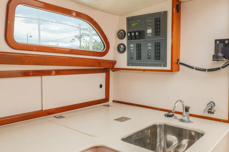 Slide: The Image of Interior of a 2005 Morris M36 sailboat with control panel and sink. - 21