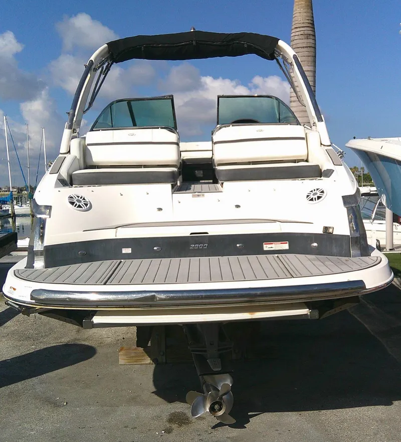 Slide: The Image of 2017 Regal 2800 Bowrider boat docked at a marina. - 11