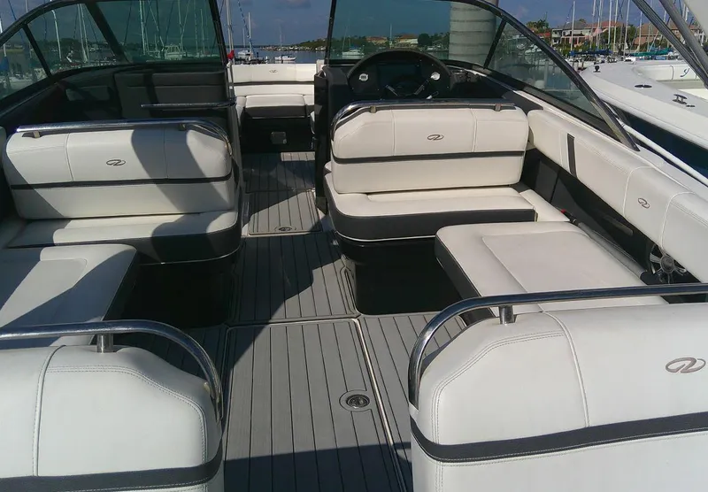 Slide: The Image of 2017 Regal 2800 Bowrider interior with white seating and spacious layout. - 12