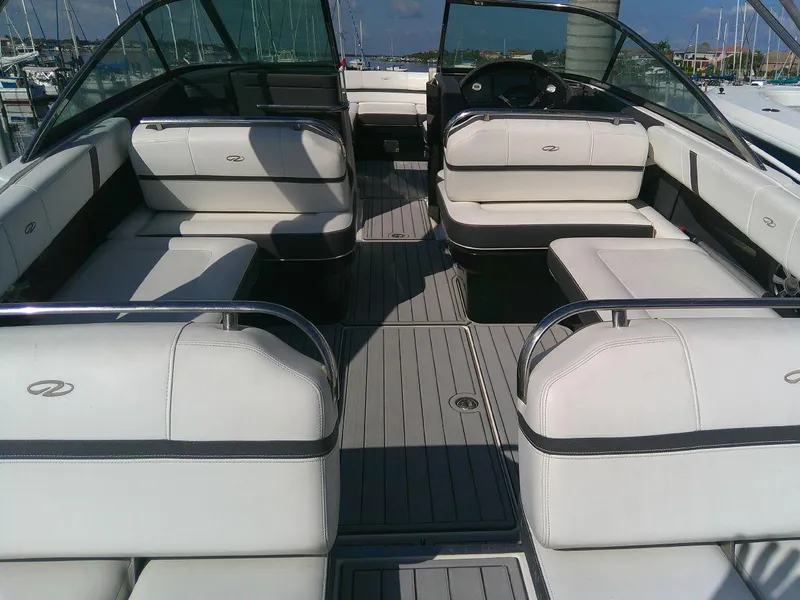 Slide: The Image of 2017 Regal 2800 Bowrider interior with white seating and spacious layout. - 13