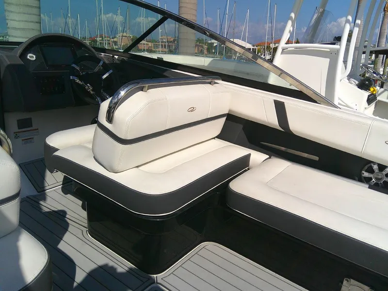Slide: The Image of 2017 Regal 2800 Bowrider interior with white and black seating. - 14