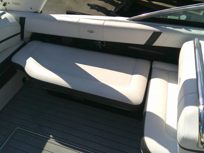 Slide: The Image of 2017 Regal 2800 Bowrider boat interior with white cushioned seating. - 17