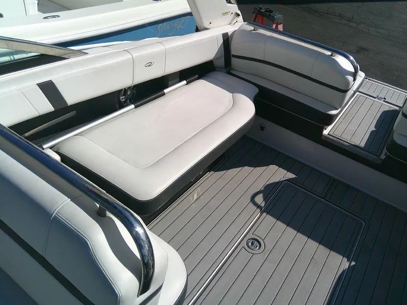 Slide: The Image of 2017 Regal 2800 Bowrider boat interior seating area with white upholstery. - 18