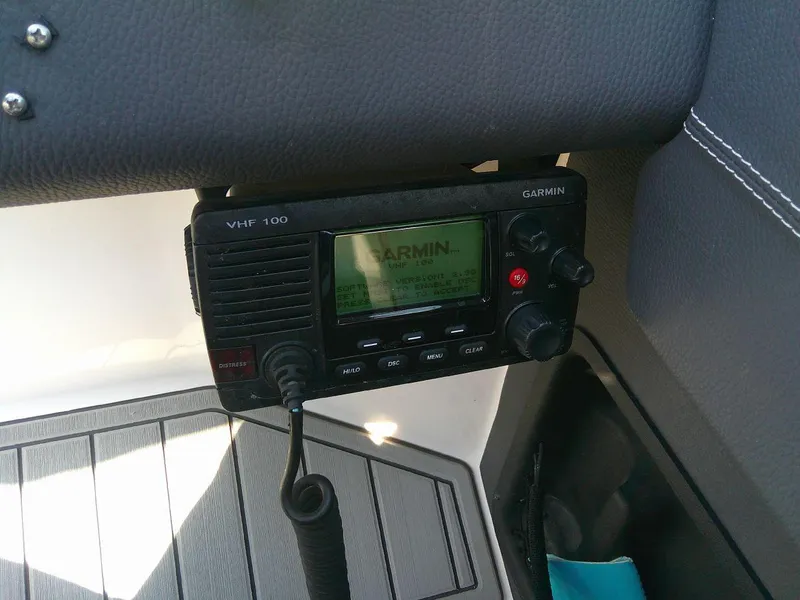 Slide: The Image of Garmin VHF 100 radio installed on a 2017 Regal 2800 Bowrider boat. - 25