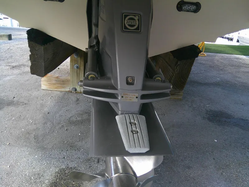 Slide: The Image of Close-up of the 2017 Regal 2800 Bowrider boat's stern drive and propeller. - 32