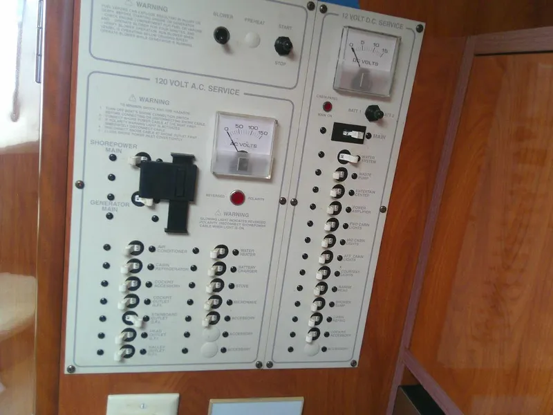 Slide: The Image of Electrical control panel of a 2005 Larson Cabrio 330 boat. - 23