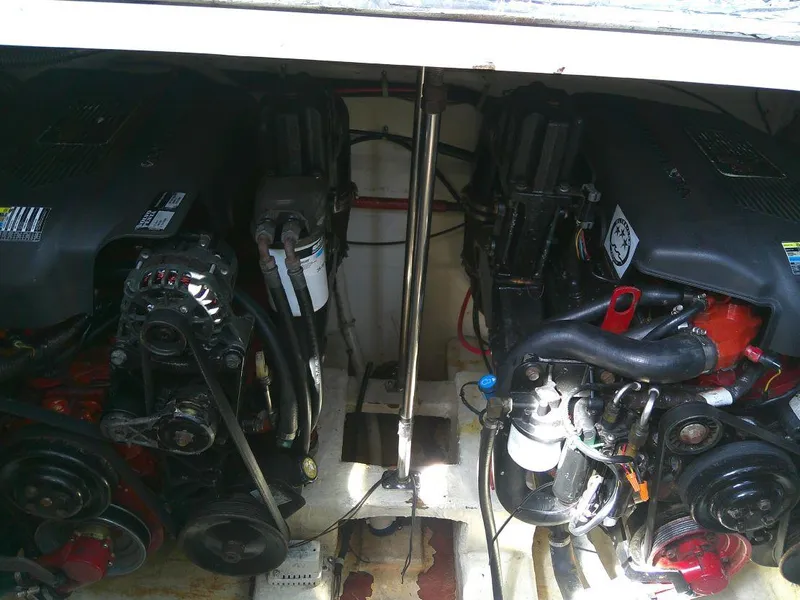 Slide: The Image of 2005 Larson Cabrio 330 engine compartment with dual engines. - 31