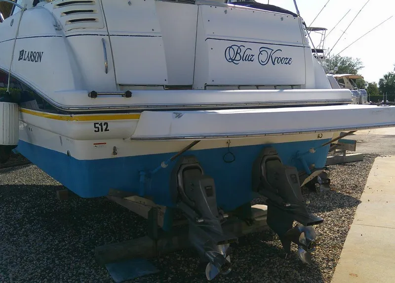 Slide: The Image of 2005 Larson Cabrio 330 boat on dry dock with dual propellers. - 6