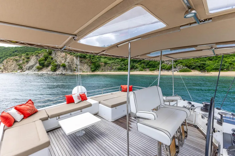 Slide: The Image of Luxurious 2012 Lagoon 560 yacht interior with scenic ocean view and comfortable seating. - 24