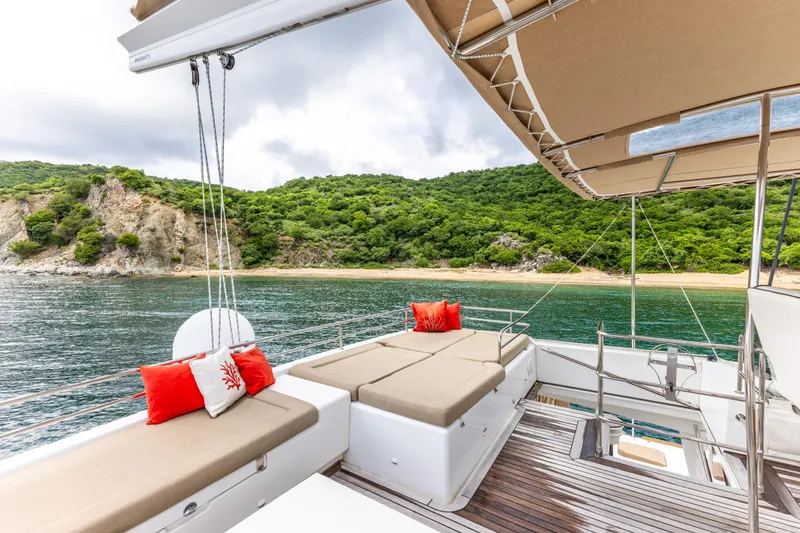 Slide: The Image of Luxurious 2012 Lagoon 560 yacht deck with scenic coastal view and comfortable seating. - 29