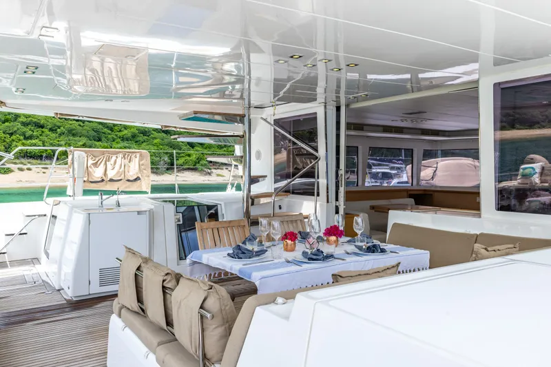 Slide: The Image of Luxurious Lagoon 560 yacht interior with elegant dining setup, 2012 model. - 31