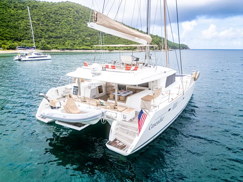 Slide: The Image of Luxurious 2012 Lagoon 560 catamaran anchored in serene tropical waters. - 4