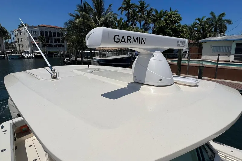 Slide: The Image of 2024 Scout 355 LXF boat with Garmin radar on the roof. - 19