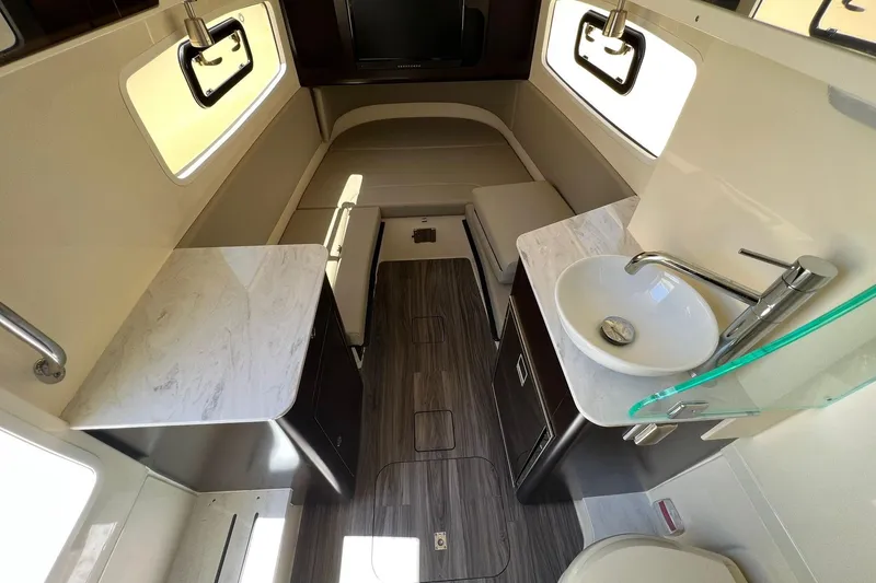 Slide: The Image of 2024 Scout 355 LXF cabin interior with modern amenities and sleek design. - 21