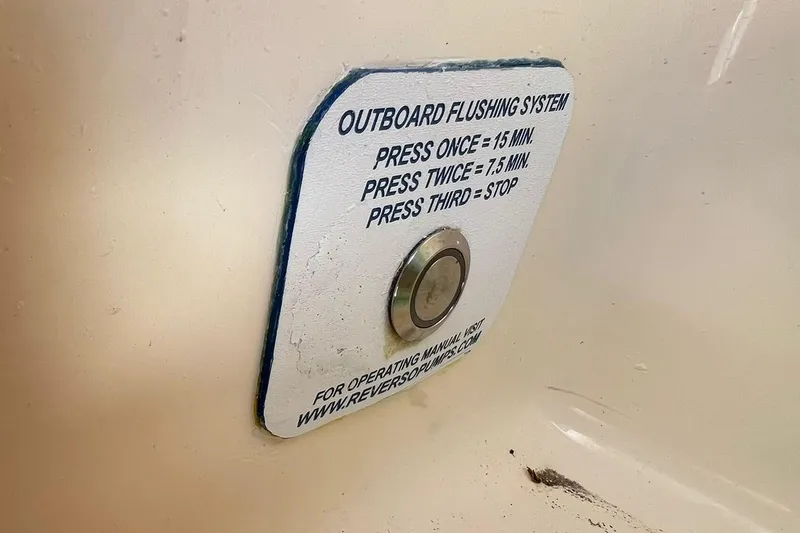 Slide: The Image of 2024 Scout 355 LXF outboard flushing system button with instructions. - 22