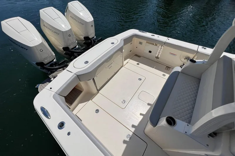 Slide: The Image of 2024 Scout 355 LXF boat with triple Mercury outboard engines. - 8