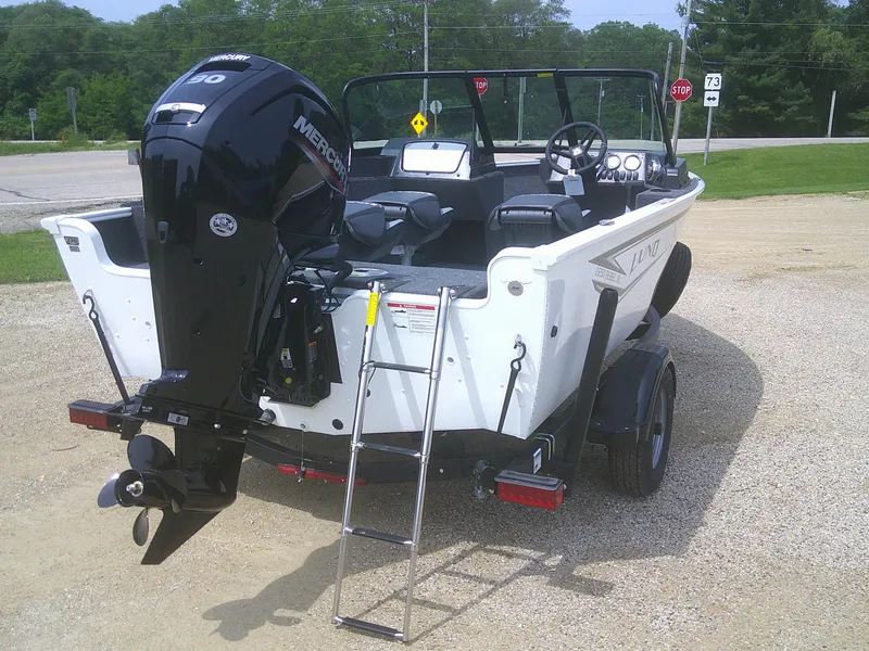Slide: The Image of 2024 Lund 1650 Rebel XL Sport boat with Mercury outboard motor and ladder. - 14