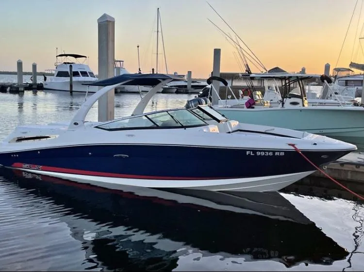 Slide: The Image of 2015 Sea Ray 250 SLX boat docked at marina during sunset. - 3
