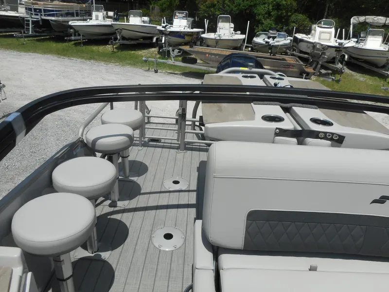 Slide: The Image of 2024 Starcraft CX 25 DL BAR pontoon boat with seating and bar stools. - 4